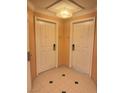 Apartment entryway with two doors and tile floor at 145 E Harmon Ave # 2306, Las Vegas, NV 89109