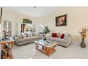 Bright and airy living room with comfortable seating and large windows at 1504 Castle Crest Dr, Las Vegas, NV 89117