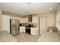 Spacious kitchen featuring stainless steel appliances and granite countertops at 3390 Syvella Ct, Las Vegas, NV 89117