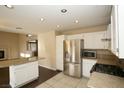 Kitchen boasts granite countertops, stainless steel appliances, and an island at 3390 Syvella Ct, Las Vegas, NV 89117