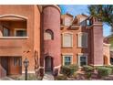 Attractive townhome with a curved facade and a Spanish-style architectural design at 3975 N Hualapai Way # 266, Las Vegas, NV 89129