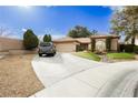 Lovely home with a spacious driveway, attached garage, and charming landscaping at 4401 Inez Dr, Las Vegas, NV 89130