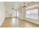 Spacious living area with tile floors and vaulted ceilings at 5055 Jacarilla Ln, North Las Vegas, NV 89031