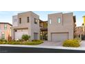 Modern two-story home with two-car garage and landscaped front yard at 5219 Iron River Ct, Las Vegas, NV 89135