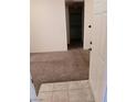 Carpeted entryway with view of laundry and hallway at 5751 E Hacienda Ave # 118, Las Vegas, NV 89122