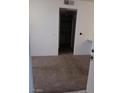 Carpeted living room with view of kitchen at 5751 E Hacienda Ave # 118, Las Vegas, NV 89122