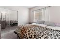 Bedroom with mirrored closet doors and leopard print bedding at 6701 Squaw Mountain Dr # 203, Las Vegas, NV 89130