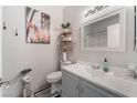 Bathroom with vanity, toilet, and a decorative mirror at 6701 Squaw Mountain Dr # 203, Las Vegas, NV 89130