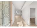 Bright and airy entryway with tile floors and stained-glass door at 8080 Black Orchid Ave, Las Vegas, NV 89131