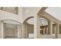Spacious living room with high ceilings and arched doorways at 9472 Ojibwa Ave, Las Vegas, NV 89149