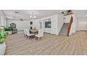 Spacious dining area with hardwood floors and a farmhouse table at 9668 Padre Peak Ct, Las Vegas, NV 89178