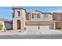 Two story stucco home with large three car garage and desert landscaping at 9668 Padre Peak Ct, Las Vegas, NV 89178