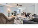 Spacious living room with comfortable seating and tile floors at 9961 Mardagen St, Las Vegas, NV 89183