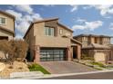 Two-story home with modern facade and landscaped yard at 10936 White Alder Pl, Las Vegas, NV 89138