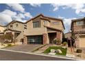 Two-story home with modern facade and landscaped yard at 10936 White Alder Pl, Las Vegas, NV 89138