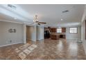 Open concept floor plan with tile flooring leading into the kitchen and dining area at 11106 Cherokee Landing St, Las Vegas, NV 89179