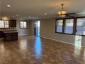 Spacious living room with tile flooring and sliding glass doors at 11106 Cherokee Landing St, Las Vegas, NV 89179