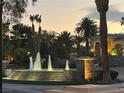 Evening view of community fountain and entrance at 2050 W Warm Springs Rd # 712, Henderson, NV 89014