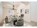 Formal dining room featuring a glass table, seating for eight, and stylish chandelier at 2520 Palmridge Dr, Las Vegas, NV 89134