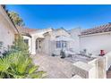 Charming courtyard with brick pavers and seating area at 2612 Harrisburg Ave, Henderson, NV 89052