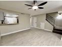 Bright living room with laminate floors and ceiling fan at 2631 Aracatuba Ave, Las Vegas, NV 89121