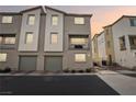 Modern three-story townhome with a two-car garage and private backyard at 2669 Champagne Gold Ave, North Las Vegas, NV 89086