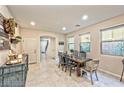 Bright dining room with rustic wooden table and blue buffet at 2934 Tremont Ave, Henderson, NV 89052