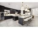 Spacious kitchen with island, stainless steel appliances, and white cabinetry at 304 Elder View Dr, Las Vegas, NV 89138