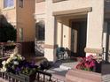 Front porch with seating and flower planters at 3679 Wild Springs St, Las Vegas, NV 89129