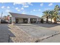 House with covered entryway, gated entrance, and desert landscaping at 4365 Topaz St, Las Vegas, NV 89121