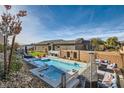 Stunning pool and spa with outdoor seating and a fire pit at 49 Strada Caruso, Henderson, NV 89011