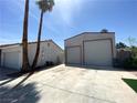 View of a detached two-car garage with roll-up doors at 5515 Coley Ave, Las Vegas, NV 89146