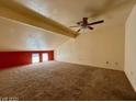 Spacious loft area with carpeted floors and a ceiling fan at 569 Sellers Pl # 569, Henderson, NV 89011