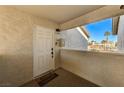 Front door entry with private balcony and view of the pool at 7300 Pirates Cove Rd # 2013, Las Vegas, NV 89145