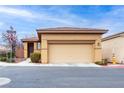 Inviting single-story home featuring a spacious two-car garage and manicured landscaping at 7611 Redcloud Peak St, Las Vegas, NV 89166