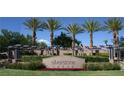 Silverstone Ranch entrance with palm trees and pergola at 8316 Broad Peak Dr, Las Vegas, NV 89131