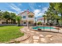 House with pool and grassy backyard at 2604 Sun Reef Rd, Las Vegas, NV 89128