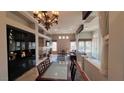 Open dining area with a view into the living room and kitchen at 10470 W Ann Rd Rd, Las Vegas, NV 89149