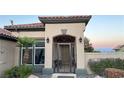 Elegant entryway with an ornate gate and well-lit exterior at 10470 W Ann Rd Rd, Las Vegas, NV 89149