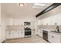 Modern kitchen featuring white shaker cabinets and quartz countertops at 1947 Balboa Ave, Las Vegas, NV 89169