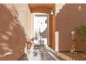 Inviting front door framed by stucco walls, a lantern, and small rock garden at 251 S Green Valley Pkwy # 1212, Henderson, NV 89012