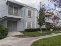 Two-story condo showcasing balconies, exterior stairs, and lush green landscaping at 3823 S Maryland Pkwy # C3, Las Vegas, NV 89119