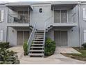 Two-story condo features exterior stairs leading to balconies, and manicured bushes at 3823 S Maryland Pkwy # C3, Las Vegas, NV 89119