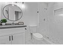 Modern bathroom with white cabinets, marble shower, and updated fixtures at 4321 Mott Cir, Las Vegas, NV 89102