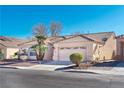 Single story home with tile roof and attached two-car garage at 4507 Golden Palomino Ln, North Las Vegas, NV 89032