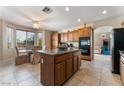 Spacious kitchen with an island and breakfast nook at 6165 Smarty Jones Ave, Las Vegas, NV 89131