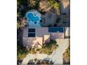 Stunning aerial view of the home, pool, and landscaped backyard with solar panels at 8365 Hauck St, Las Vegas, NV 89139