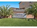 Welcoming 'Rainbow Crossing Estates' sign, complemented by vibrant greenery and manicured landscaping at 8620 Grove Mill Ct, Las Vegas, NV 89139