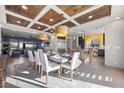 Bright dining room with a modern table and statement lighting at 8620 Grove Mill Ct, Las Vegas, NV 89139