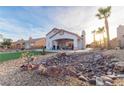 Artificial turf, rock landscaping and covered patio at 1215 Country Club Dr, Laughlin, NV 89029